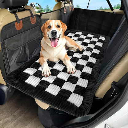 Close view of the plush bed’s checkered surface in a car