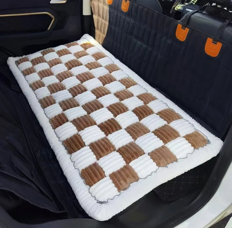 Brown-and-white dog bed installed across the back seat