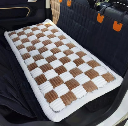 Brown-and-white dog bed installed across the back seat