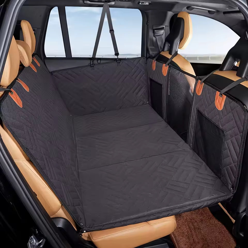 Dark hammock cover installed across a vehicle back seat
