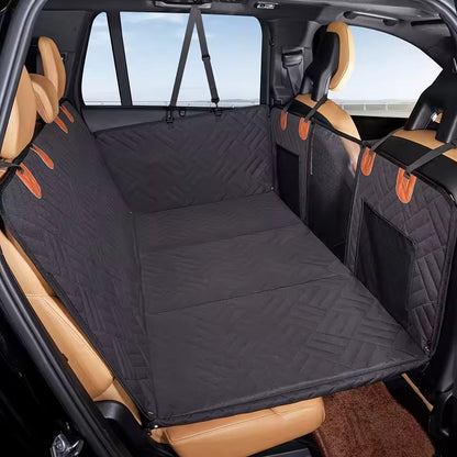 Dark hammock cover installed across a vehicle back seat