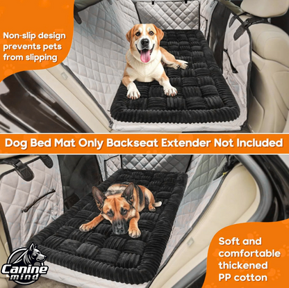 Dog resting on the plush bed in a vehicle