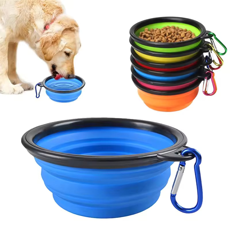 Dog drinking from a blue collapsible bowl beside stacked bowls