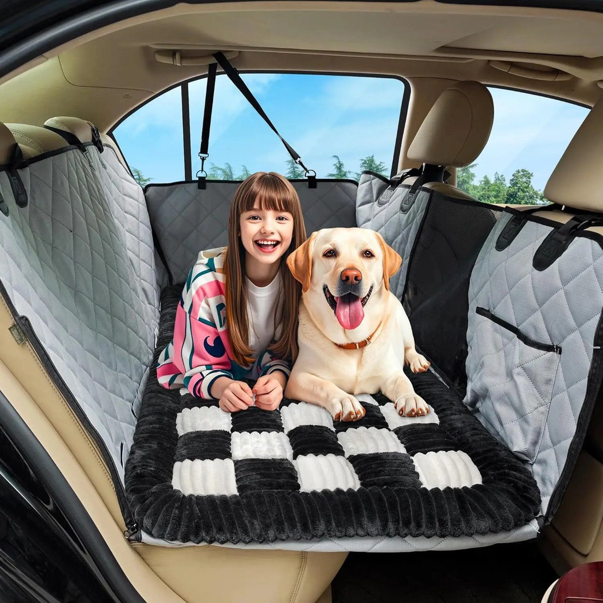 Person and dog relaxing on the plush bed in a car